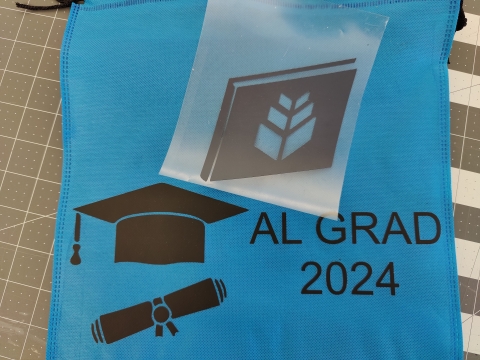 May's free vinyl of a grad hat that can be placed on a window or fabric 
